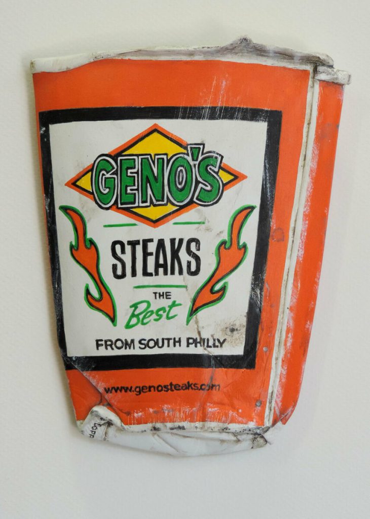 Acrylic painting on shaped basswood of a crumpled orange Geno's Steaks paper bag with flame graphics.