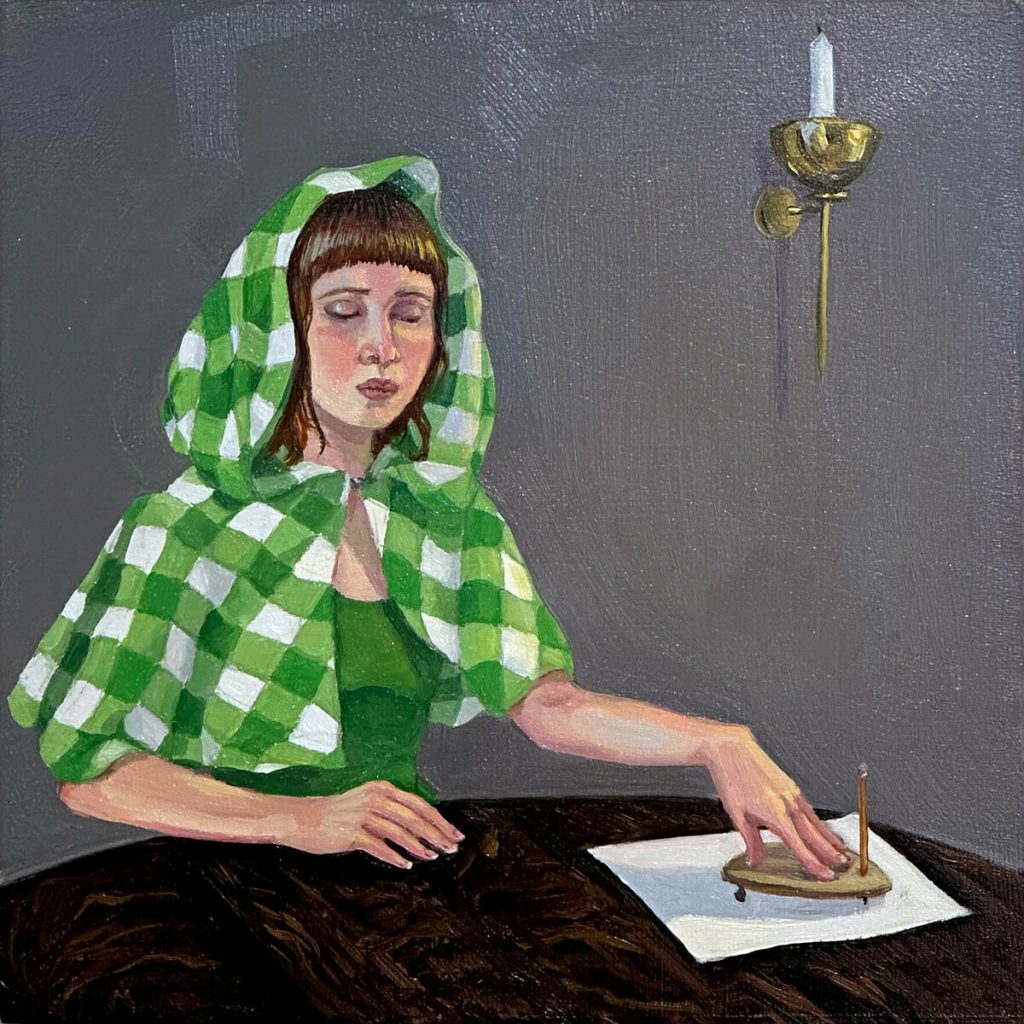 Oil painting of a woman in a green gingham hood touching a small brass object on a table beside a wall candle sconce.