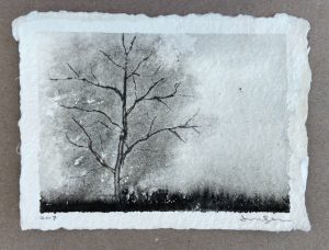 Ink drawing of a bare winter tree against a misty grey sky above a dark band of low shrubs.