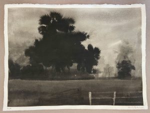 Ink and salt landscape of a large dark tree silhouette over a flat meadow with a wooden fence in the foreground.