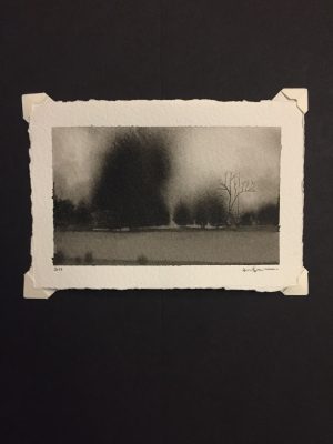 Ink wash landscape of dark massed trees and a single bare skeletal tree against a pale grey sky.