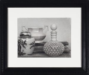 Charcoal drawing of a still life with a Chinese ginger jar, two-handled urn, and hobnail glass decanter on stacked books.