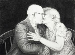 Charcoal drawing of an elderly couple kissing on a bench, their arms wrapped around each other.